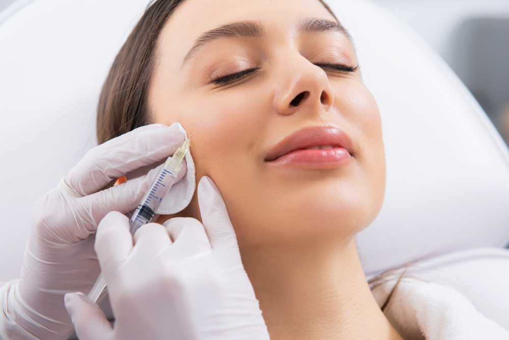 A client receiving a facial aesthetic treatment